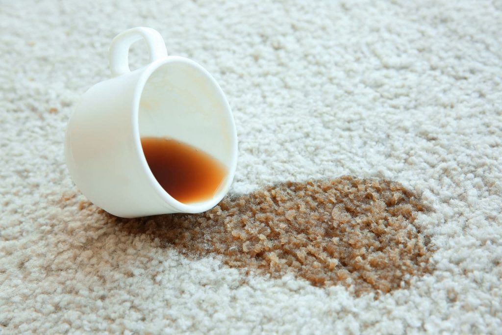 a cup of coffee spilled on the floor