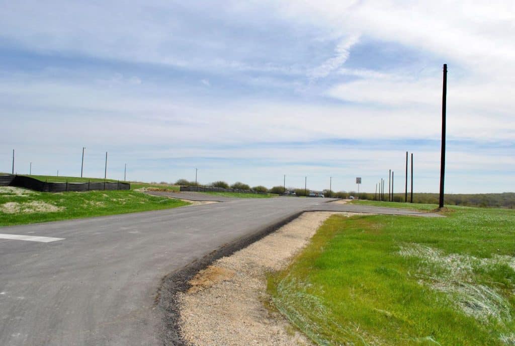 a road with a poles on the side of it