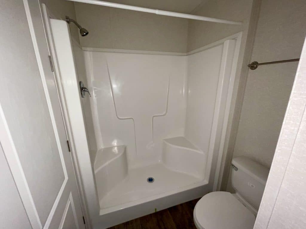 bathroom tub and toilet wide angle