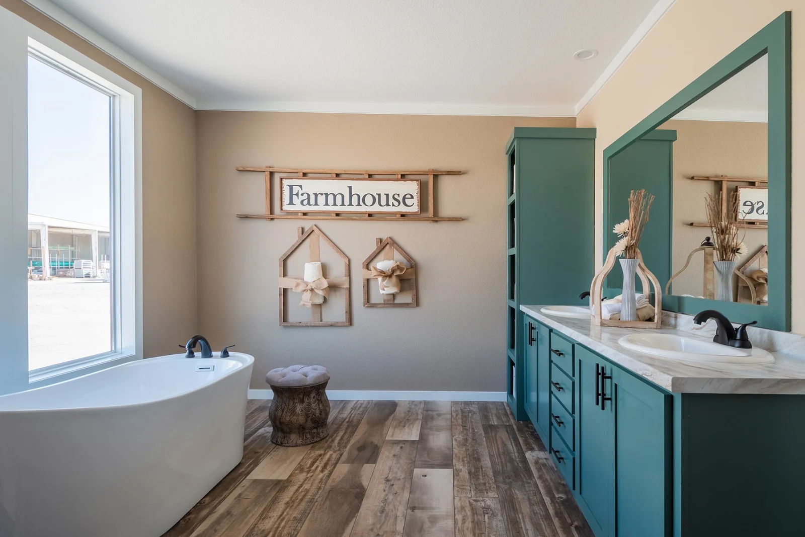 master bathroom with bathtub , sink and mirror